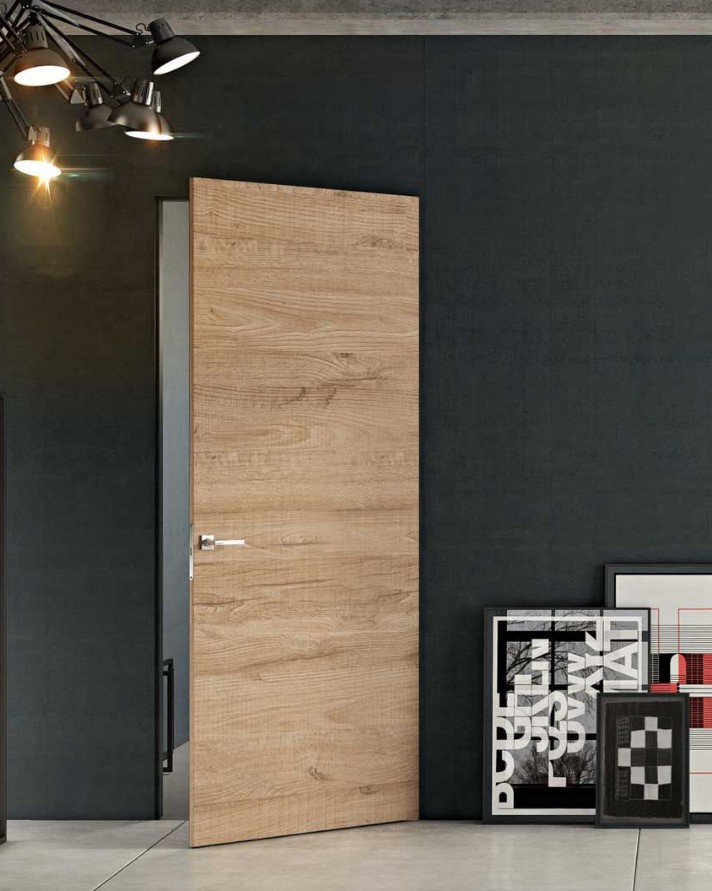 Puerta rasomuro Mimetica de Pail Porte integrada en la pared
