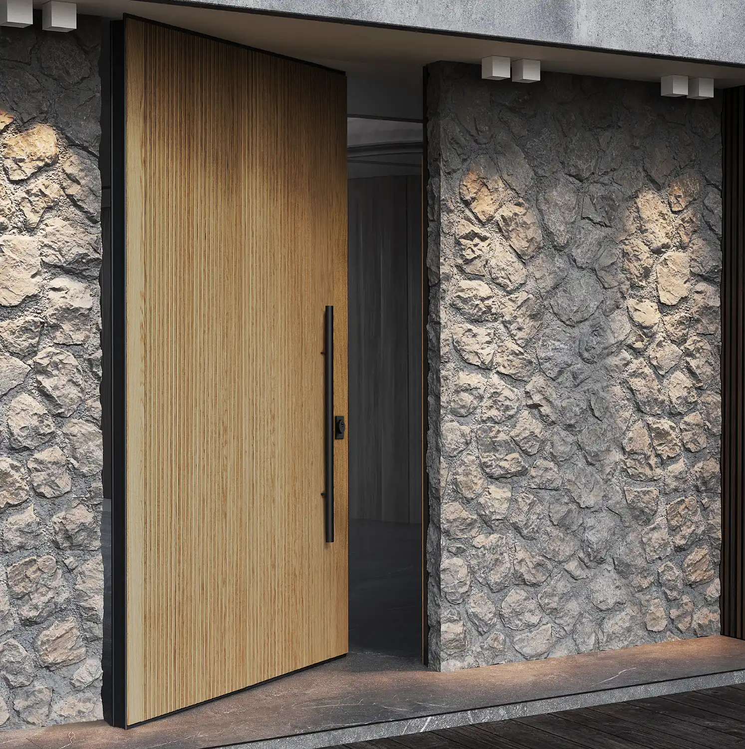 Puerta pivotante ICA PIVO con acabado de madera en una fachada de piedra