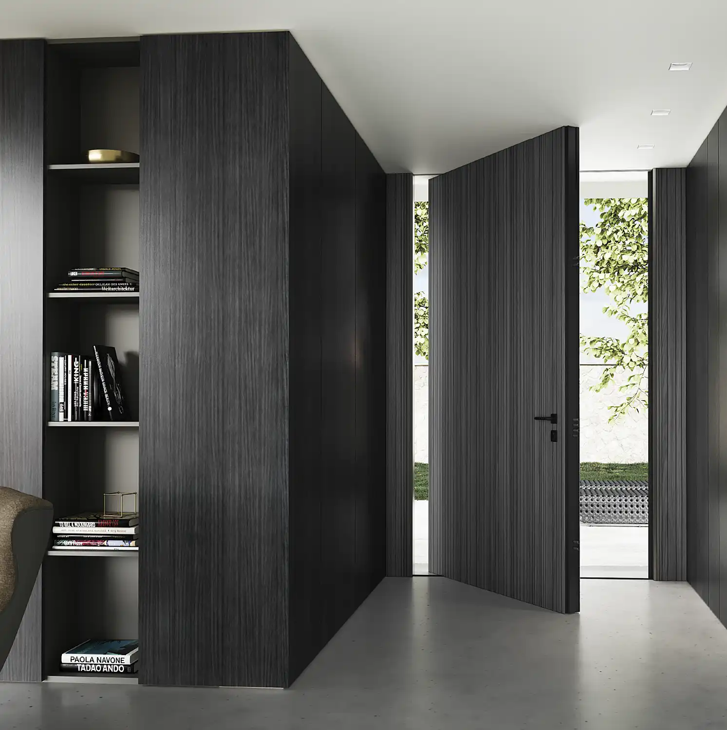 Puerta pivotante ICA PIVO integrada en una boiserie interior oscura